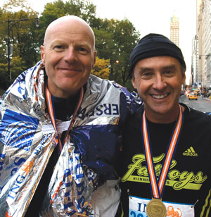 Tom Curry, left, and Paul Steep, pose at Central Park South after finishing the New York City Marathon with respectable times.