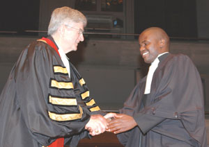 Wiri Kapurura, right, is congratulated by Law Society of Upper Canada Treasurer Derry Millar.