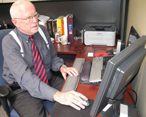 Tom Granger, 75, talks to a colleague using Skype from his office in London last week.