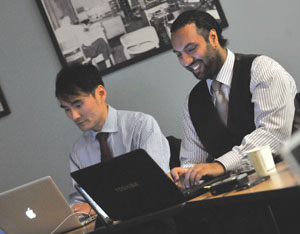 Lee Akazaki, left, and Omar Ha-Redeye had lots to say as they tweeted during the Law Society of Upper Canada’s public debate on articling last Thursday. Photo: Laura Pedersen
