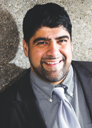 Hussein Hamdani believes his support for the Liberals may be a factor in his removal from a national security roundtable.