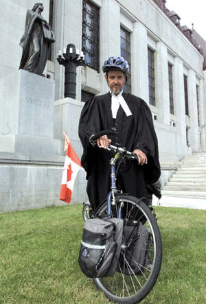 Dugald Christie, shown here in front of the Supreme Court of Canada in 2000, was killed while riding across Canada.